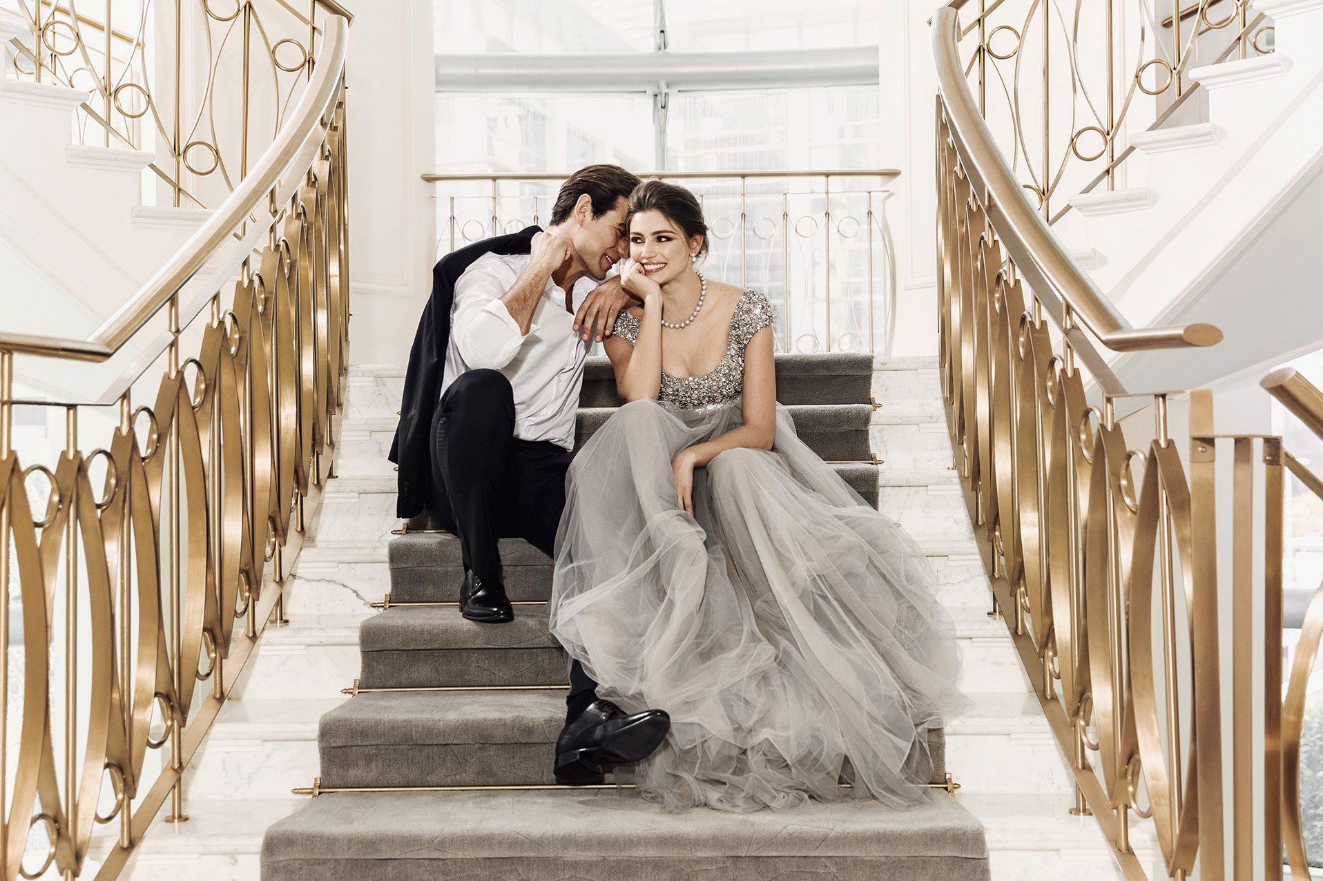 A couple on the grand staircase at Address Boulevard