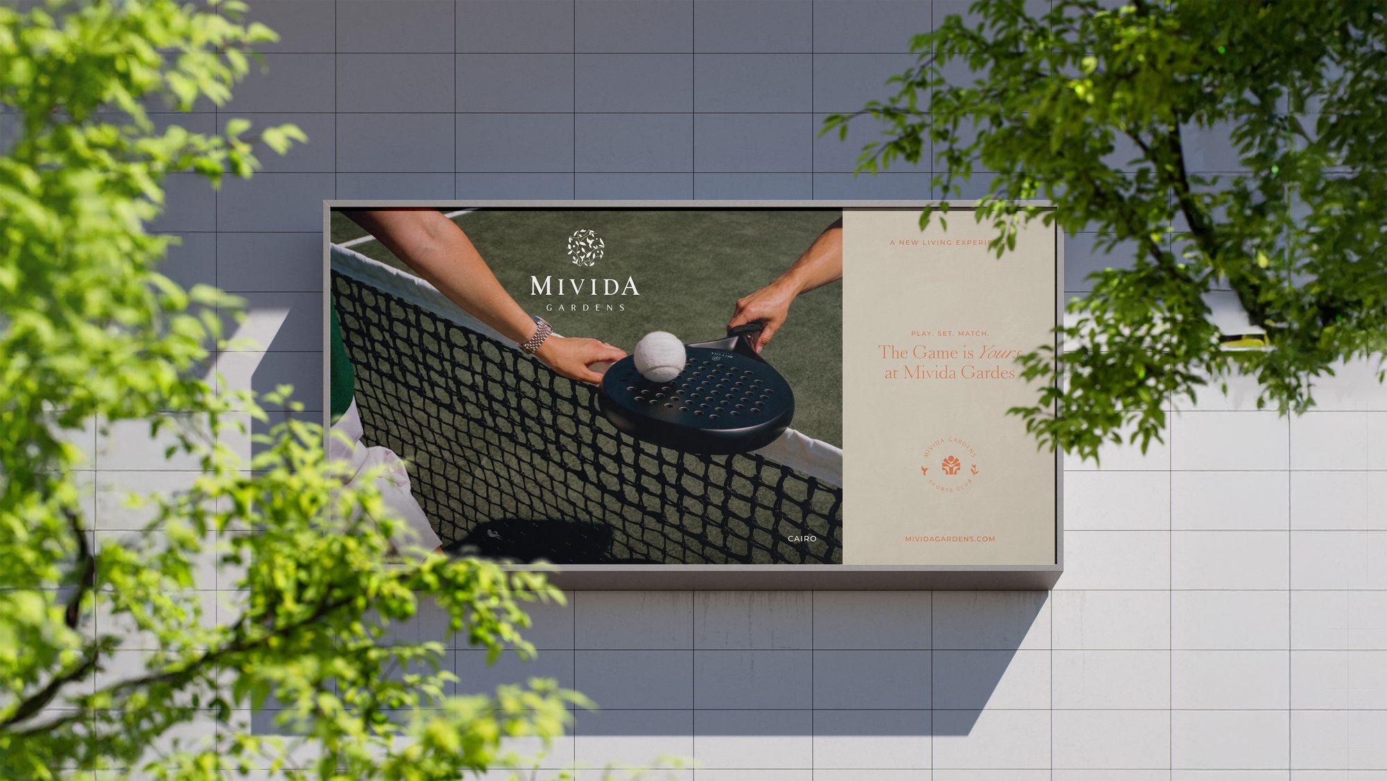 A Mivida Gardens billboard — “The game is yours · A new living experience”