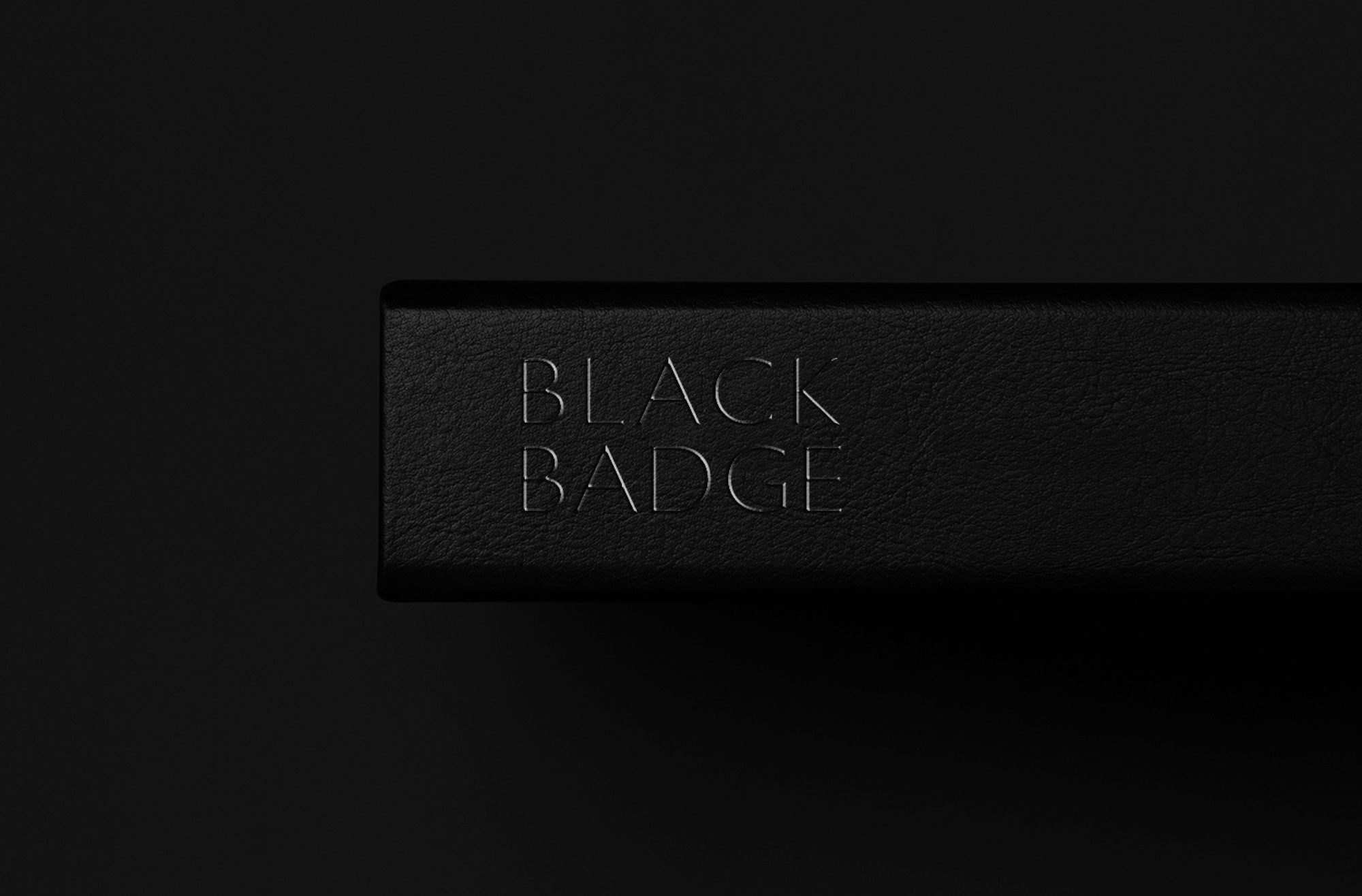 The Black Badge wordmark, debossed
