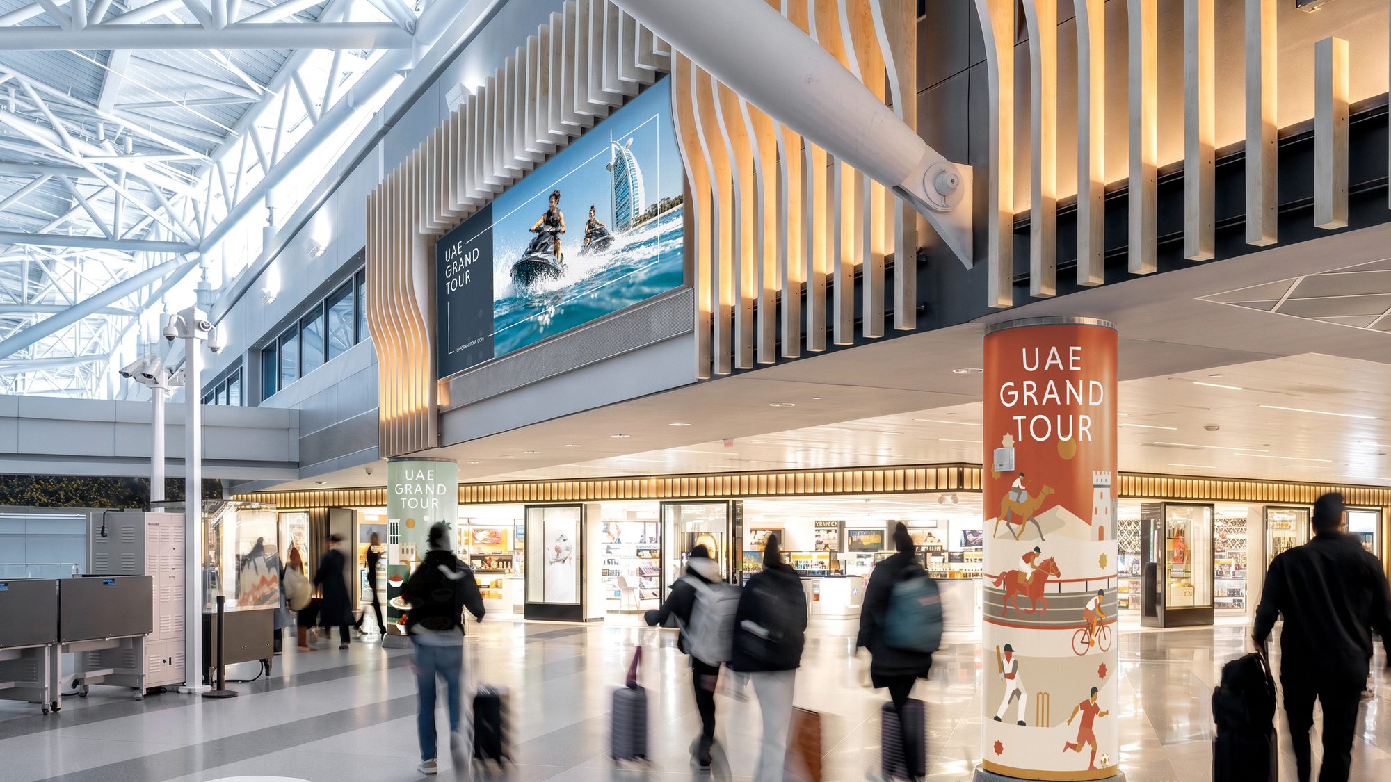 UAE Grand Tour advertising at the airport — the arrival into the journey