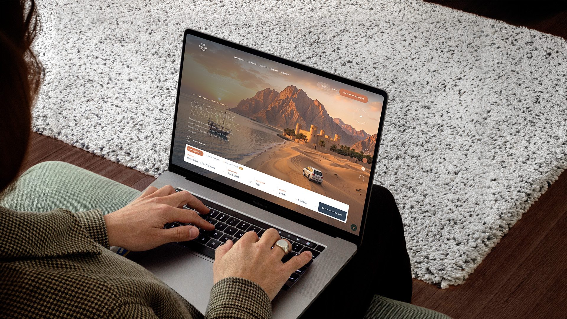 The UAE Grand Tour platform — one country, seven journeys — on desktop